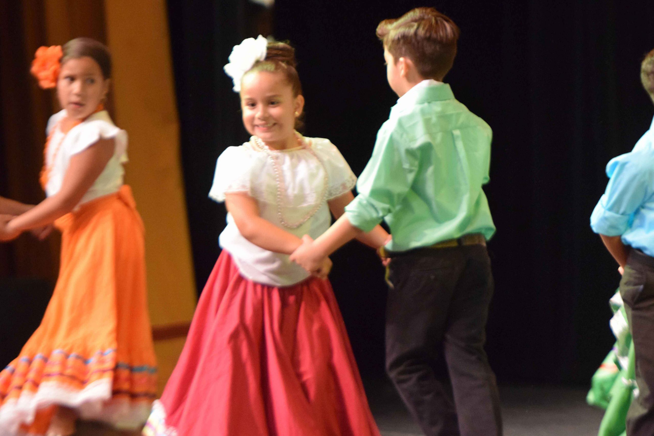 Photo of young Los Lupeños Academy students dancing at recital